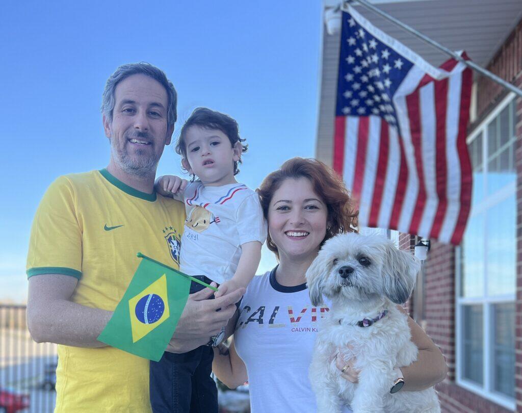 Geraldo and Evelyne Goncalves with their son and dog