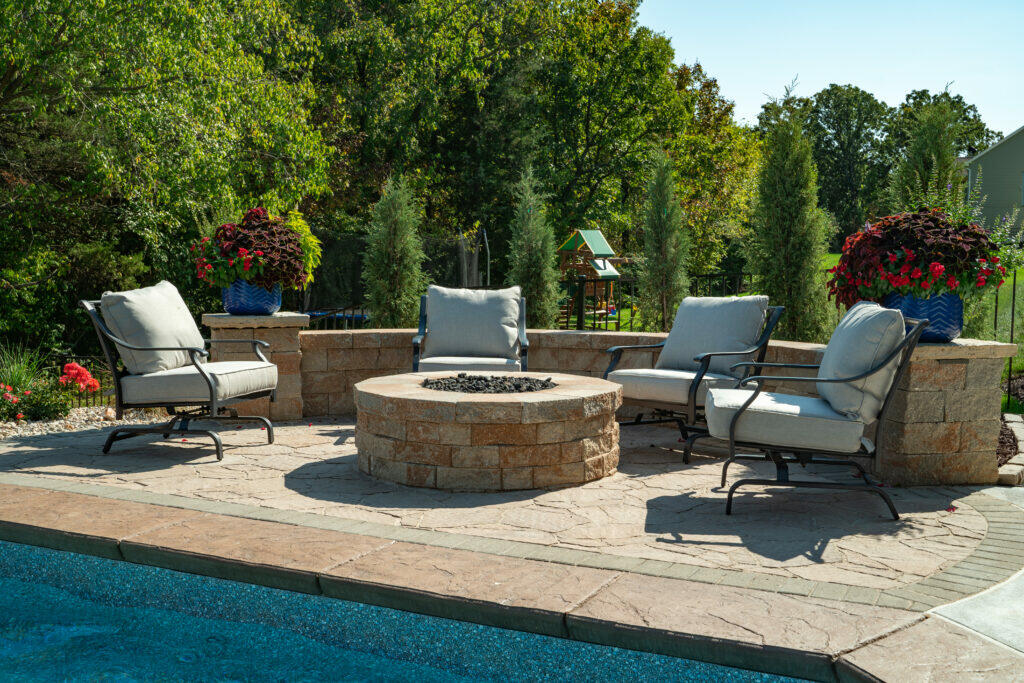 round retaining wall fire pit by pool
