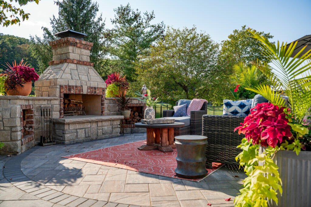 paver patio with stone fireplace
