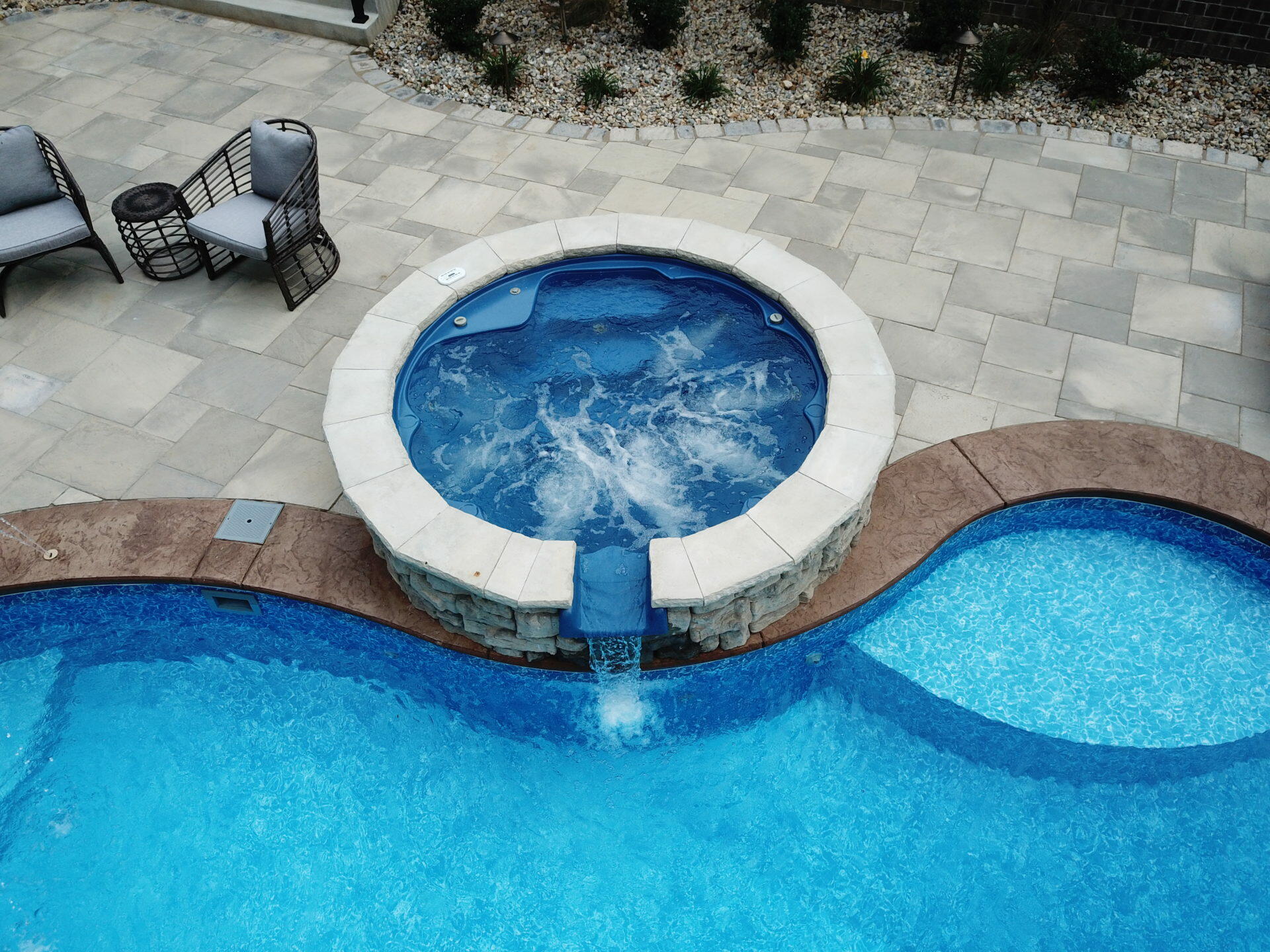 patio paver with hot tub and pool