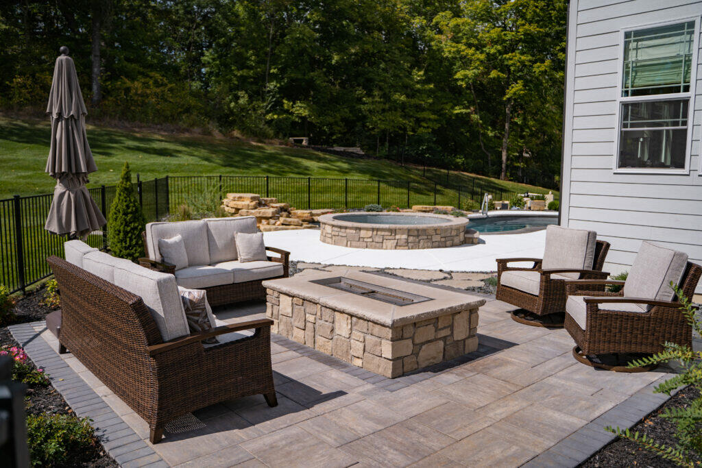 modern fire pit table with retaining wall blocks