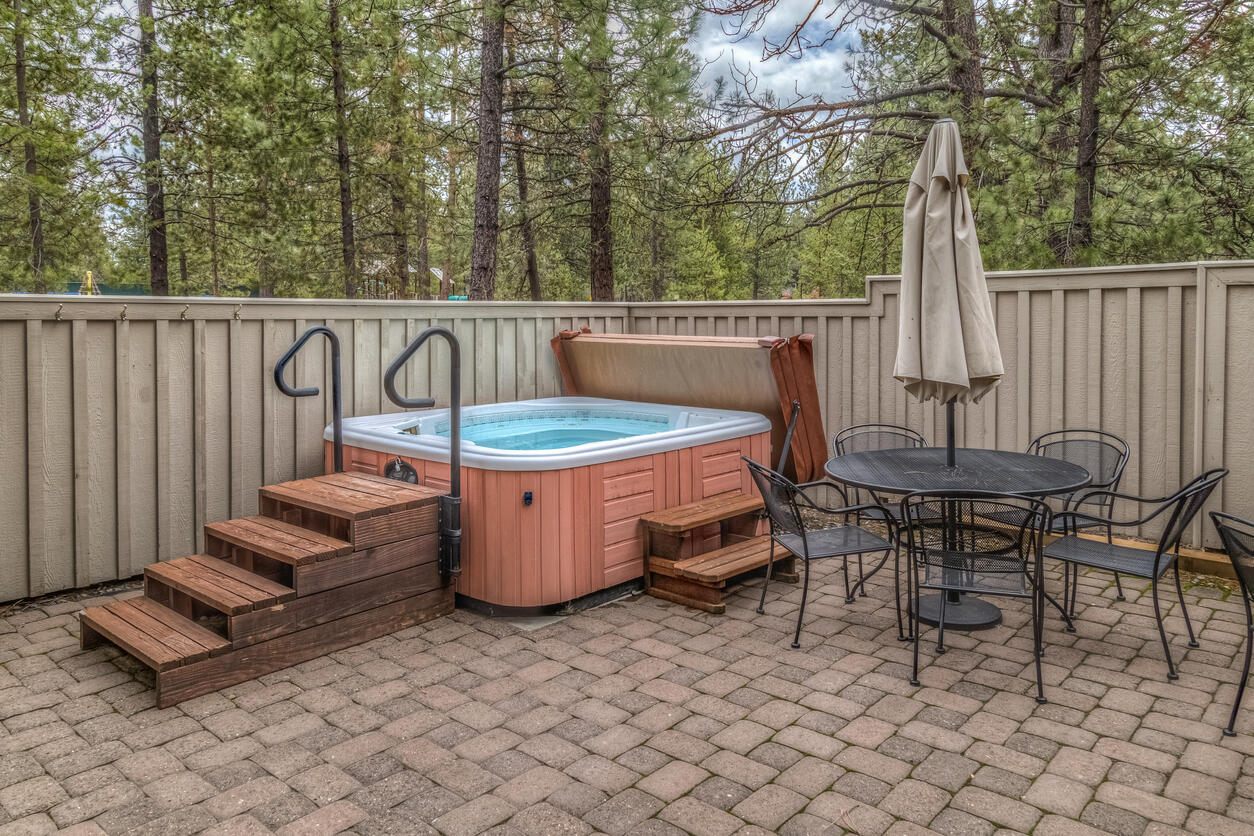 outdoor hot tub on a backyard patio